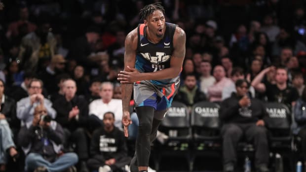 January 27, 2024; Brooklyn Nets forward Dorian Finney-Smith (28) celebrates after making a three pointer in the third quarter against the Houston Rockets